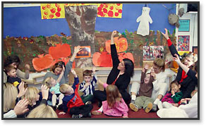 Photo of kids & parents on floor